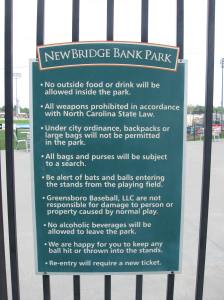 Before you read any of the signs inside the park, the Greensboro Grasshoppers lay down the law.